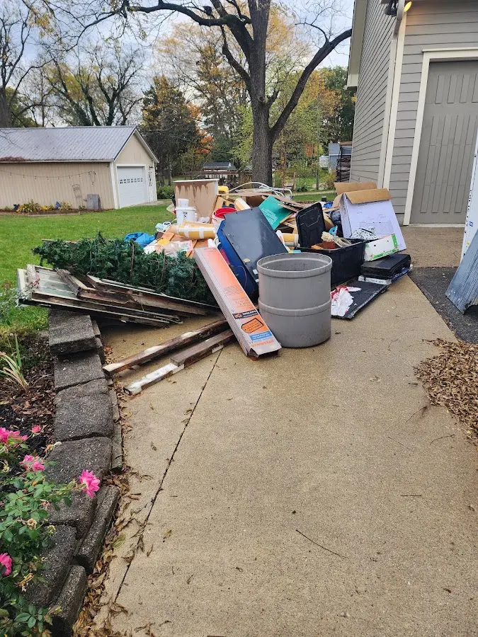 Dumpster being loaded with debris for Roofing Dumpster Rental in Whittier